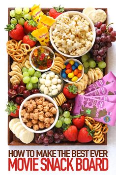 the movie snack board is full of snacks, fruit, and crackers to make the best ever