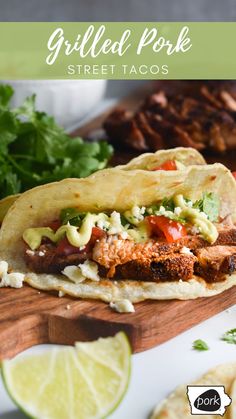 grilled pork street tacos on a cutting board with lime wedges