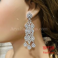 Designer CZ Cocktail Earrings Party/Trendy/Silver Cubic Zirconia Earrings/Ethnic earrings/American Diamond Earrings Made in Brass in Rhodium finish Length: Approx. 2.5 Inches Available in Rhodium Silver Finish Made with very high quality Cubic Zirconia Stones Lightweight Jewelry Suitable for any traditional or contemporary occasion Very Elegant and stylish, suitable for any attire. Comes with push back closure Bridal Jhumka, Sabyasachi Earrings, American Diamond Earrings, Cocktail Earrings, Contemporary Earrings, Chandbali Earrings, Light Weight Jewelry, Western Earrings, Indian Weddings