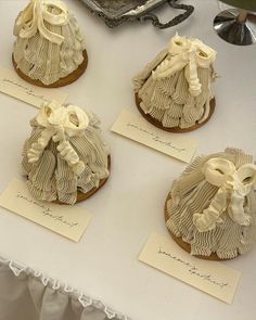 four decorated cakes sitting on top of a table