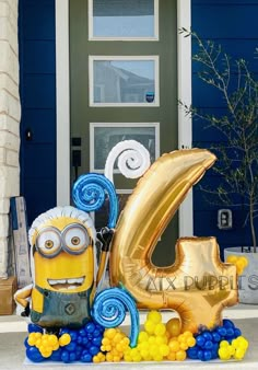 a large balloon shaped like the number six with two minion figures in front of it