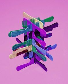 there are many toothbrushes stacked on top of each other