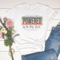 Powered By The Holy Spirit Graphic T-Shirt Georgia Fashion, Be Encouraged, The Holy Spirit, Walk By Faith, Christian Shirts, Christian Gifts, Unisex Shirts, Printing Methods, Holy Spirit