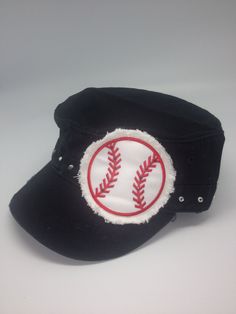 a black baseball cap with a red and white ball in the center on a white background