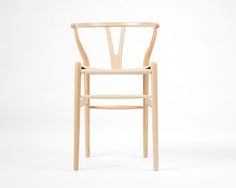 a wooden chair sitting on top of a white floor