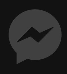 a black and gray speech bubble with an arrow in it's center on a dark background