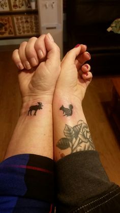 two people with matching tattoos on their arms