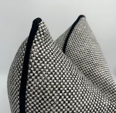 a black and white checkered bag sitting on top of a table