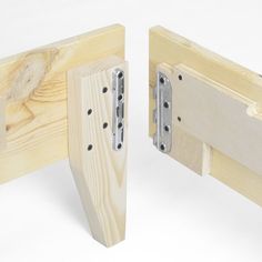 two pieces of wood with metal brackets attached to them