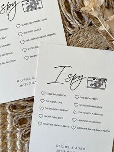 two wedding programs on top of each other next to some dried flowers and straw grass