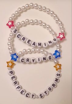 some beads with words and stars on them