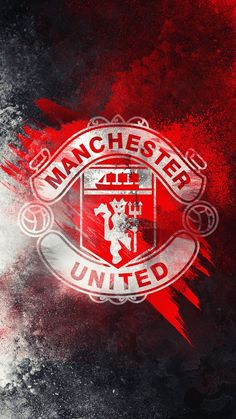 the manchester united logo on a black and red background with white paint splatters