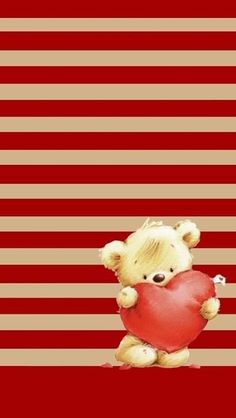 a teddy bear holding a heart in front of a striped background