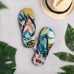 Slide into these and prepare your feet for a vacation. In Hawai'i they are called slippers, or slippahs. Comfortable and stylish, these slippers are a staple for those landlocked or ocean bound. Get ready for an adventurous and carefree day with a pair of these colorful slippers. The floral print features bright snapdragons, buds and the signature opihi shell. The rubber sole is lined with a soft fabric to make sure you feel comfortable wherever your day takes you. * Rubber sole * Customizable 100% polyester fabric lining * Black Y-shaped rubber straps * Toe post style If you'd like to purchase this design on a different product, please don't hesitate to reach out or check out our other Etsy shop at https://www.etsy.com/shop/HappyHugsHawaii?ref=seller-platform-mcnav You can also partner th Casual Beach Swimwear With Hibiscus Print, Casual Hibiscus Print Swimwear For Beach, Beachy Flip Flops For Poolside And Beach Season, Beach Season Beachy Flip Flops For Poolside, Multicolor Flip Flops For Beach Vacation, Multicolor Flip Flops For Beach Season Vacation, Black Tropical Style Flip Flops For Summer, Black Tropical Flip Flops For Summer, Tropical Style Surfing Flip Flops For Summer