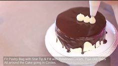 a chocolate cake sitting on top of a white plate