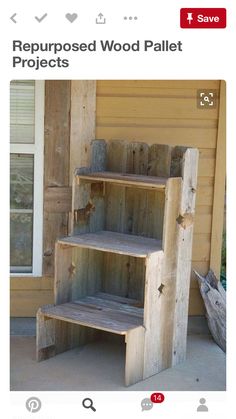 a wooden shelf sitting on the side of a house