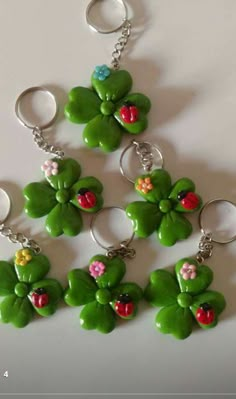 six green shamrocks with ladybugs on them are arranged in the shape of four leaf clovers