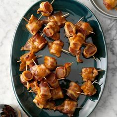 bacon wrapped in toothpicks on a green plate