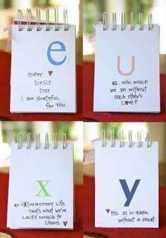 four small notepads with the letters e, u, and y written on them