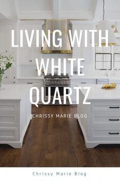 a kitchen with white cabinets and wood floors in the center, is featured by chelsea marie blog