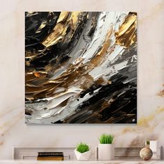 an abstract painting in gold, white and black on a wall above a fireplace mantel