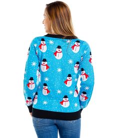 Frosty the Snowman may be cool, but have you heard of Snazzy the Snowman? At least, we like to hope that's what this dude is called. Our Women's Snazzy Snowman cardigan features our favorite Christmas characters bopping around your torso on a sky blue background. It's the perfect chilly nod to the festive season we need, without having to dress head to toe in red and green. Got a last-minute office party? Throw it on for that instant Christmas angel effect. Dress it up for all-nighters or take i Sky Blue Background, Tipsy Elves, Christmas Outfits Women, Mens Cardigan Sweater, A Sky, Christmas Outfits, Christmas Characters, Chic Sweaters, Urban Chic