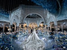 the bride and groom are standing in front of an elaborately decorated wedding ceremony hall