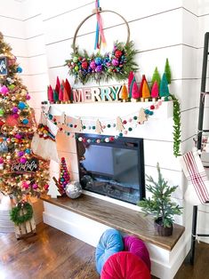 a decorated christmas tree in the corner of a living room next to a fire place