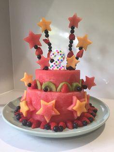 a watermelon and kiwi cake with stars on it