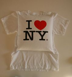 a t - shirt with the word i love new york printed on it and a red heart