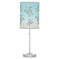 a table lamp with sea turtles on it