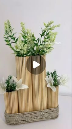 a bamboo basket with flowers in it sitting on a table