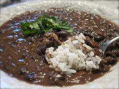 a white plate topped with beans and rice