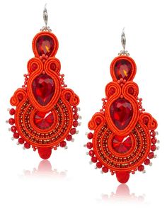 House of Perna Designed by Amanda Perna and handmade by artisans in Colombia, these earrings are ready to make a statement. They come in a range of sizes and colors so there's the perfect pair for you... and a friend! Designed in Delray Beach, Fl Handmade in Colombia Approximately 3" Handmade Artisan Red Earrings, Handmade Elegant Orange Beaded Earrings, Elegant Handmade Orange Beaded Earrings, Handmade Dangle Crystal Earrings, Artisan Dangle Earrings For Party, Artisan Drop Earrings For Party, Festive Handmade Orange Earrings, Maximalist Style, Soutache Earrings