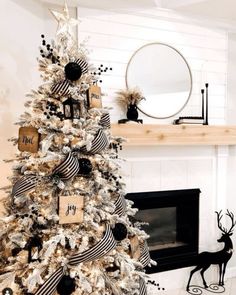 a decorated christmas tree with black and white ornaments