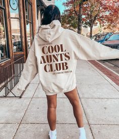 Celebrate Your Cool Aunt with Our Chic Cool Aunts Club Hoodie! 🎁 The Perfect Gift for Your Beloved Aunt! Introducing our stylish Cool Aunts Club hoodie, an ideal present for birthdays, Mother's Day, or Christmas! WHY YOU'LL LOVE OUR HOODIE: - Trendy Design: Elevate your aunt's style with our chic Cool Aunts Club hoodie. - Versatile Gift: Perfect for any special occasion, from birthdays to Christmas. - Premium Quality: Crafted from ultra-soft, high-quality materials for ultimate comfort. HOW TO Aunt And Niece Matching Outfits, Niece Gifts From Aunt, Auntie Era Sweatshirt, Auntie Sweatshirt Ideas, Aunt Sweatshirt Ideas, Cool Aunt Sweatshirt, New Aunt Gift Ideas, Aunt Names To Be Called, Cool Aunt Aesthetic