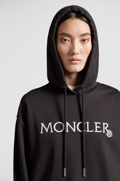 A Moncler classic, this hoodie is embellished with an embroidered logo across the chest. The loose fit sweatshirt is crafted from lightweight jersey and fleece. Casual Sweatshirt With Appliqué Logo For Fall, Luxury Long Sleeve Hoodie With Logo Print, Luxury Cotton Hoodie Sweatshirt, Casual Sweatshirt With Appliqué Logo For Streetwear, Black Athleisure Hoodie With Embroidered Logo, Luxury Cotton Sweatshirt With Embroidered Logo, Luxury Logo Long Sleeve Sweatshirt, Luxury Long Sleeve Logo Sweatshirt, Luxury Black Sweatshirt With Embroidered Logo