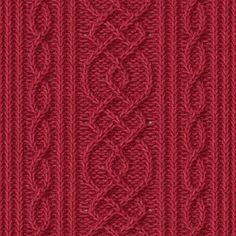 a red knitted background with an intricate design on the front and back side of it