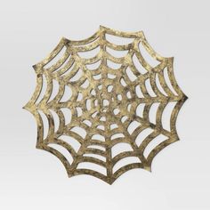 a golden spider web on a white background