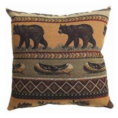 a decorative pillow with bears and birds on it