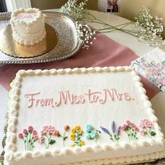 there is a cake on the table with flowers