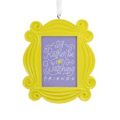 a yellow frame hanging from a string with the words, i'd rather be watching friends