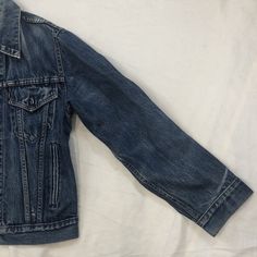 Vintage Levi’s Denim Jacket 1950s-1980s made in USA size: 42, Large measurements: armpit to armpit: 22” top of neck to bottom: 24.5” Classic Fitted Levi's Denim Jacket, Levi's Classic Fitted Denim Jacket, Vintage Fitted Levi's Denim Jacket, Levi's Fitted Vintage Denim Jacket, Fitted Vintage Levi's Outerwear, Levi's Vintage Cotton Denim Jacket, Levi's Vintage Denim Blue Jacket, Levi's Vintage Blue Denim Jacket, Levi's Vintage Medium Wash Outerwear