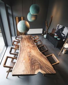 a large wooden table sitting inside of a living room