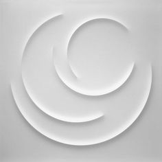 an abstract white background with three circular shapes in the center and one circle at the bottom