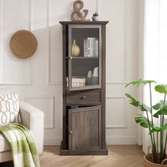 a living room scene with focus on the corner cabinet