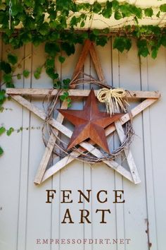 a wooden star hanging on the side of a building