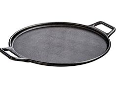 an empty cast iron skillet on a white background