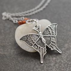 Butterfly Necklace  with faceted hessonite garnet gemstones with silver pewter ring & butterfly pendant. a perfect nature-inspired gift for a loved one, a special friend, or just for you! DETAILS  ♥  Pendant is 1.1/2 inches in length. ♥  On an 18-inch stainless steel chain. ♥  All of my pewters are lead-free. ♥  I use all-natural gemstones and freshwater pearls. SHIPMENT & DELIVERY ♥  All my items are ready to ship within 1-3 business days. ♥  Packages are typically shipped via USPS First Class Mail in 2-6 business days including tracking and delivery confirmation. KEEP SHOPPING WILDHAREGEMS Return to my main shop page here: ♥ https://www.etsy.com/shop/Wildharegems Silver Butterfly Nature-inspired Jewelry, Nature-inspired Sterling Silver Butterfly Jewelry, Nature-inspired Butterfly Charm Necklaces, Nickel-free Sterling Silver Butterfly Pendant Necklace, Butterfly Charm Jewelry Gift, Unique Silver Butterfly Pendant Necklace, Nickel-free Brown Jewelry For Gifts, Nickel Free Butterfly Necklace For Gifts, Bohemian Butterfly Sterling Silver Necklace