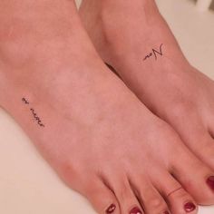 two women's feet with small tattoos on their ankles and one has the word mom written in cursive writing